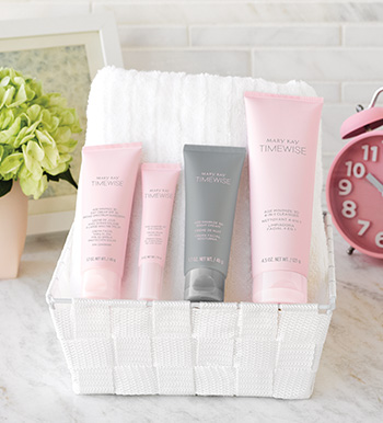 A picture of the TimeWise Miracle Set 3D anti-aging skin care set in pink and gray tubes on a white bathroom counter