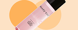 Auf einem orangefarbenen Hintergrund ist der Mary Kay Oil-Free Eye Makeup Remover zu sehen